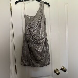 As U Wish one-shoulder dress. Metallic with swirl detail.